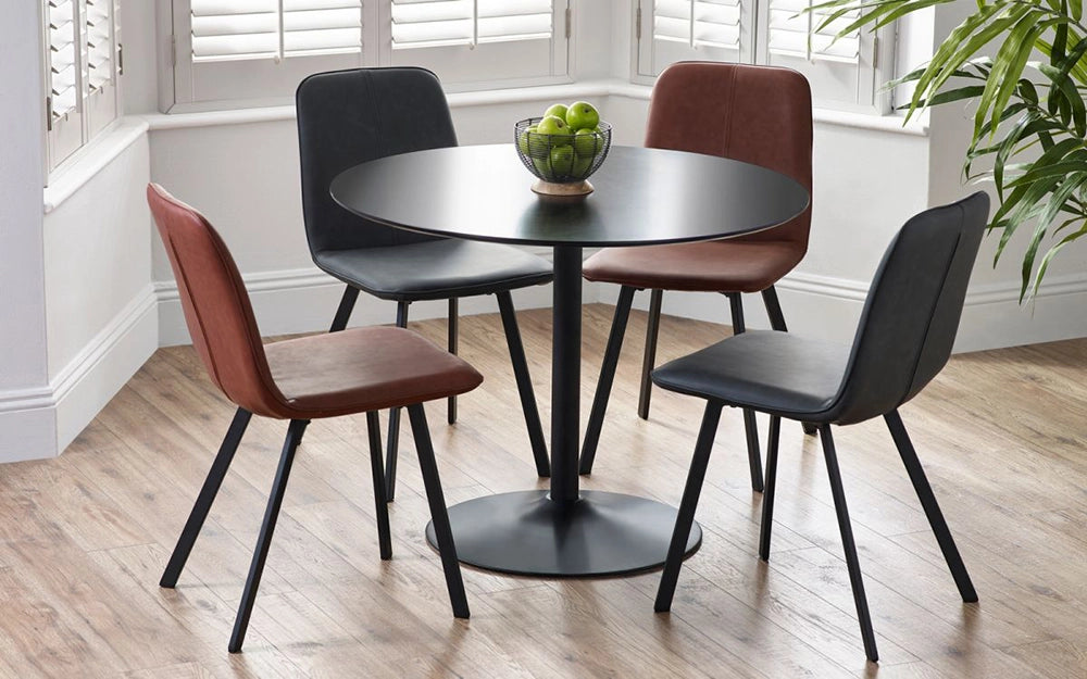 Julio Round Dining Table in Black Finish with Padded Leather Chair and Indoor Plant in Dining Setting