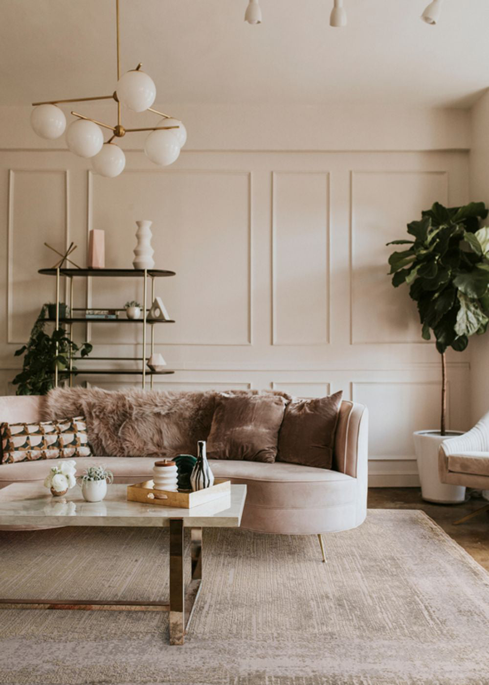 Koa Champagne and Gold Rug with Sofa and Coffee Table in Living Room Setting
