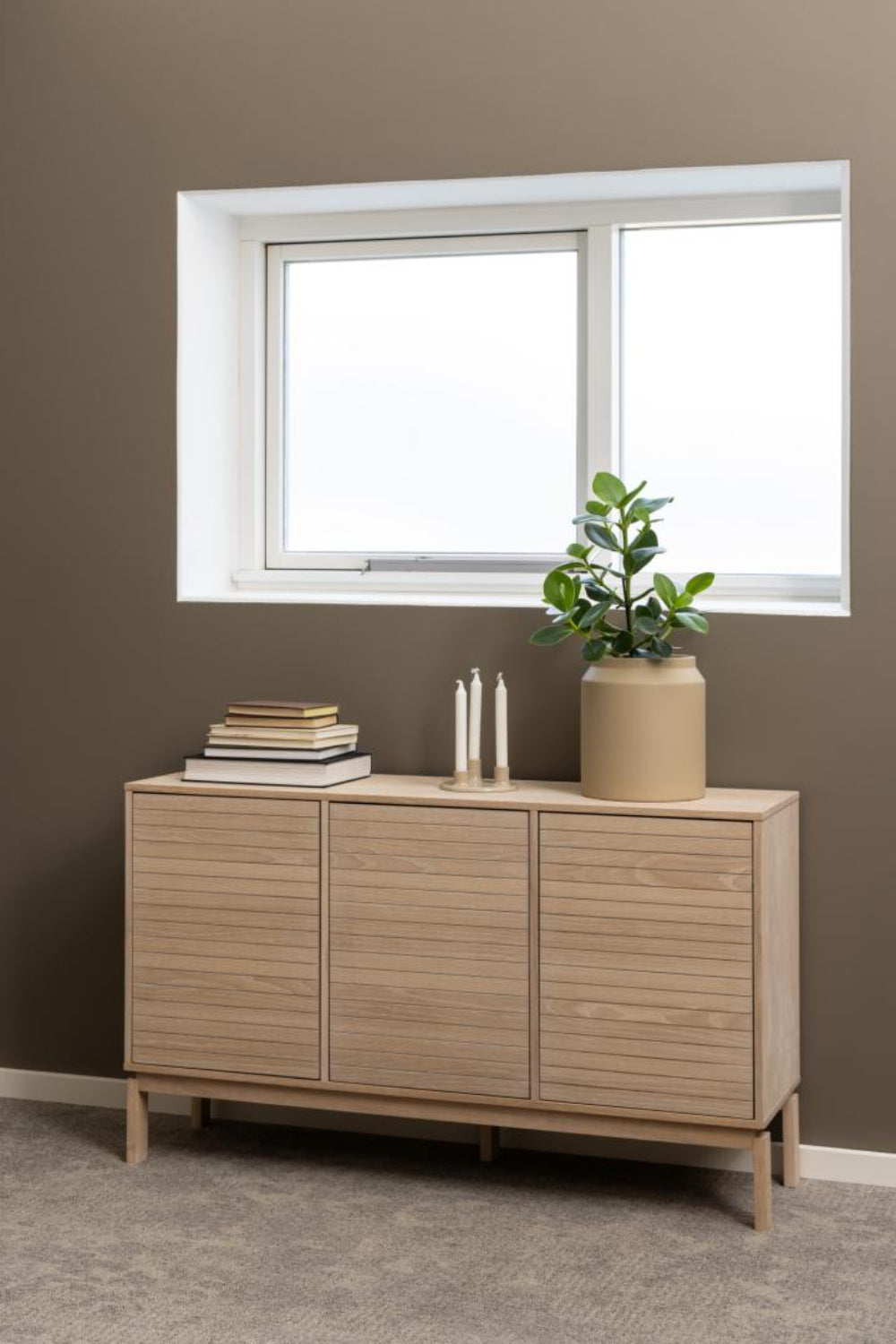 Lacey 3 Door Sideboard with Candle and Books in Dining Setting