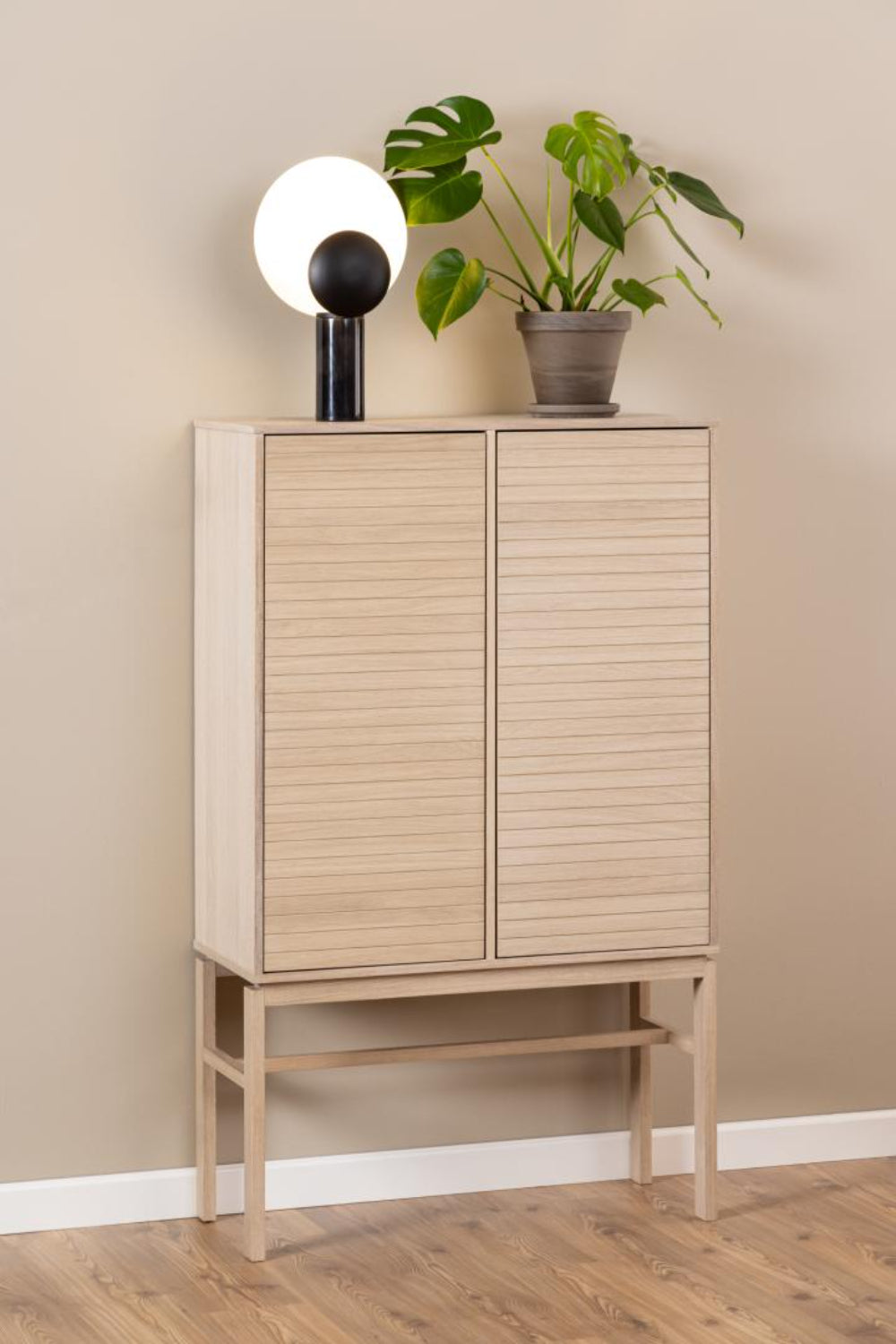 Lacey Display Cabinet with Plant and Light in Dining Setting