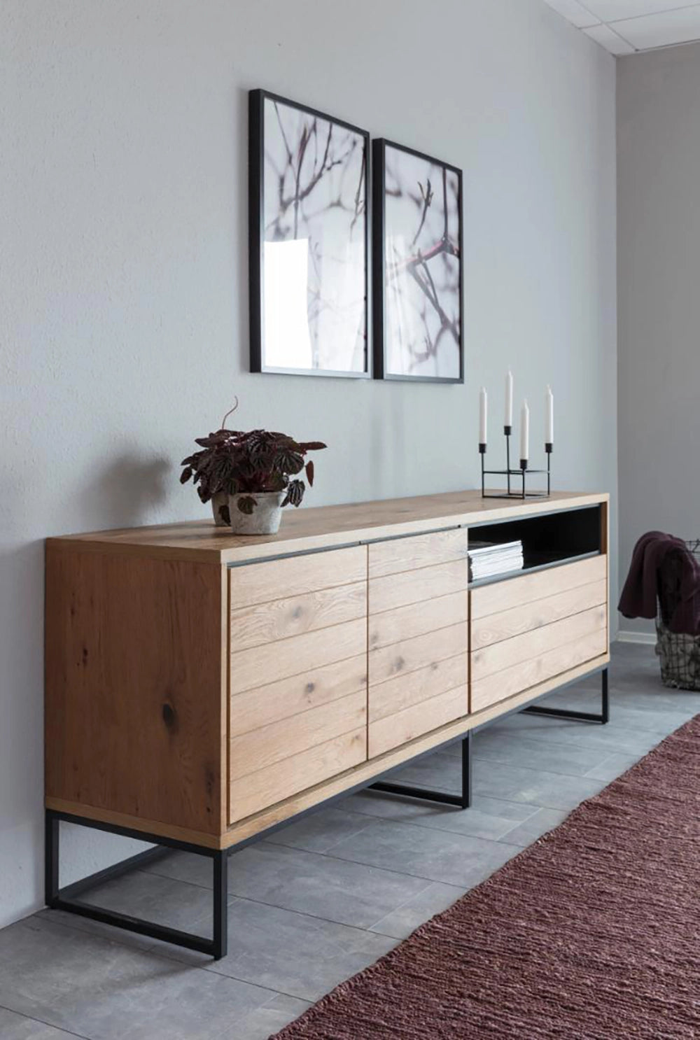 Lara Large Sideboard in Matte Oak Finish with Wall Frame and Candle in Living Room Setting
