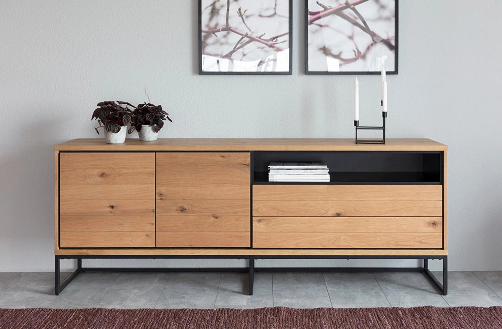 Lara Large Sideboard in Matte Oak Finish with Wall Frame and Indoor Plant in Living Room Setting