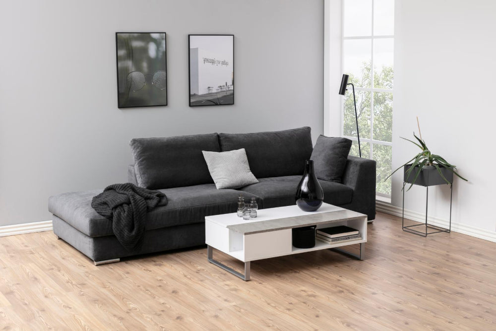 Lea Reactangular White Coffee Table with Vase and Sofa in Living Room Setting