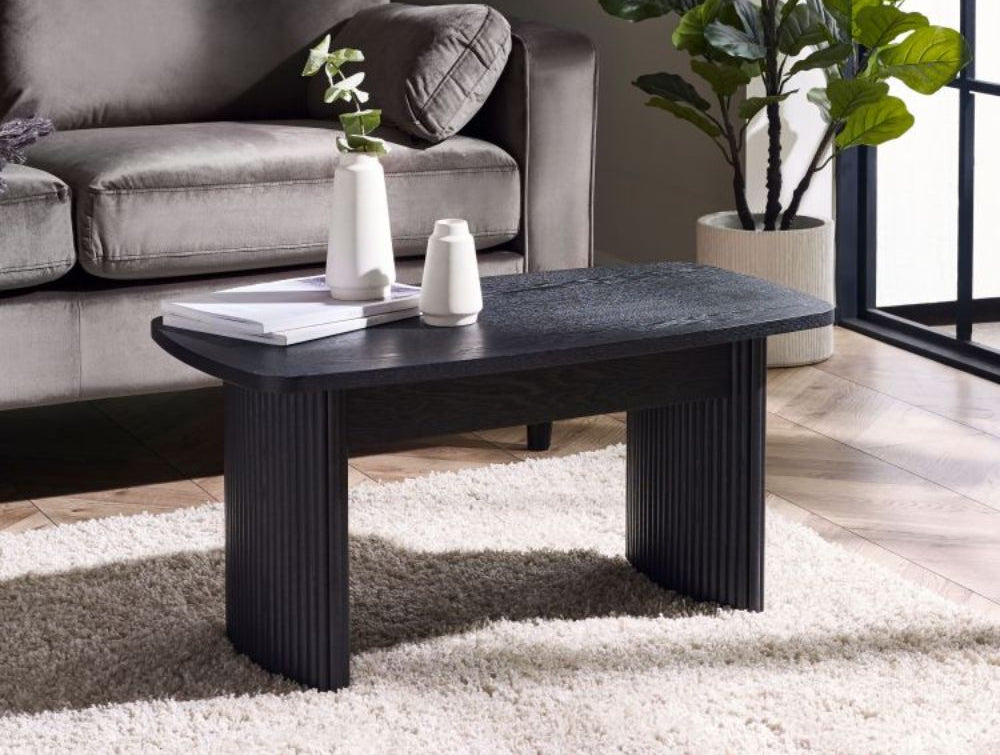 Lishan Compact Coffee Table in Ash Black Finish with Indoor Plant and Sofa in Living Room Setting Featured