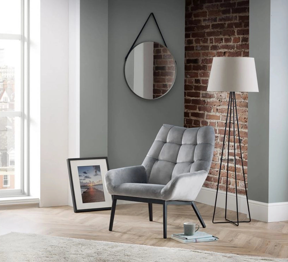 Lucie Velvet Chair in Grey Finish with White Standing Lamp and Hanging Round Mirror in Studio Setting