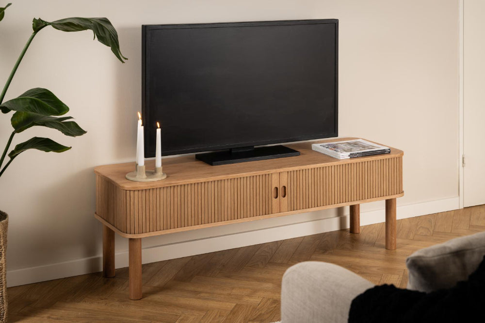 Luis Wooden Media Unit with Sofa and Candlelight in Living Room Setting