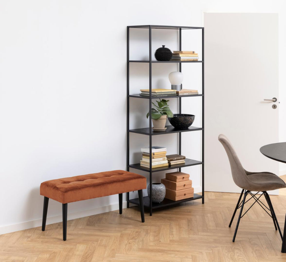 Lumina Upholstered Bench in Copper Finish with Bookshelves and Dining Chair in Living Room Setting