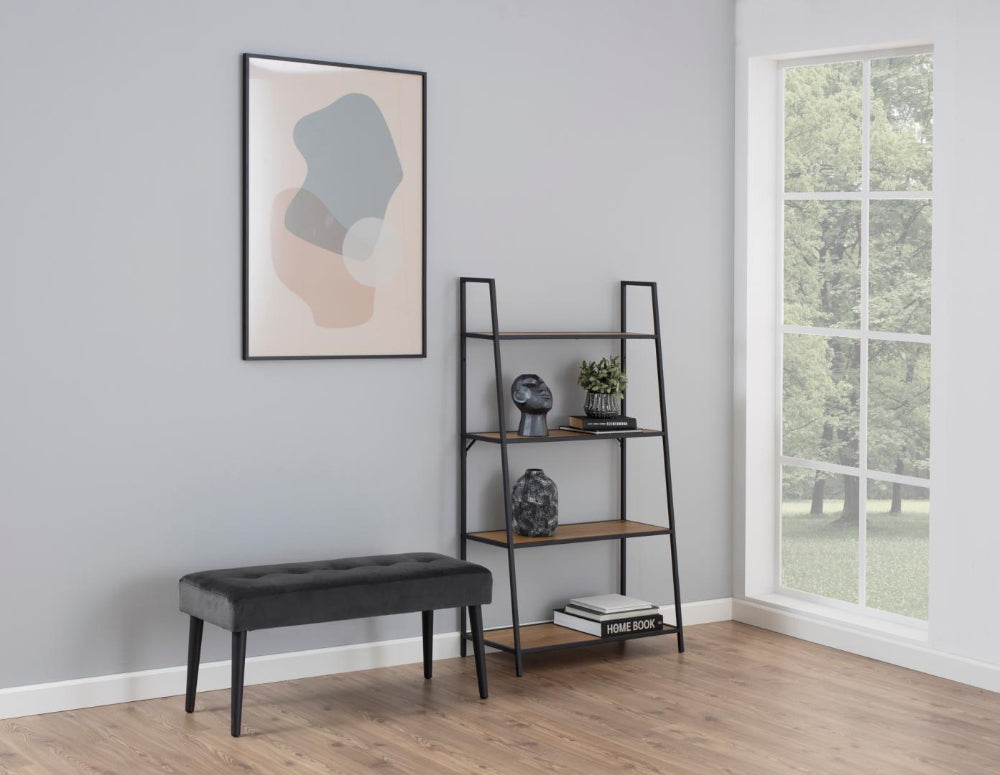 Lumina Upholstered Bench in Dark Grey Finish with Bookshelves and Books in Living Room Setting