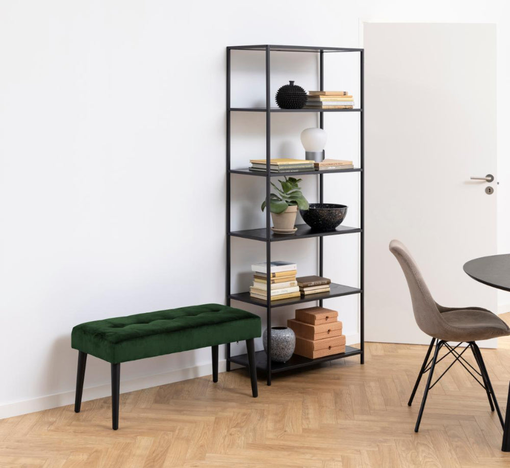 Lumina Upholstered Bench in Forest Green Finish with Bookshelves and Dining Chair in Living Room Setting