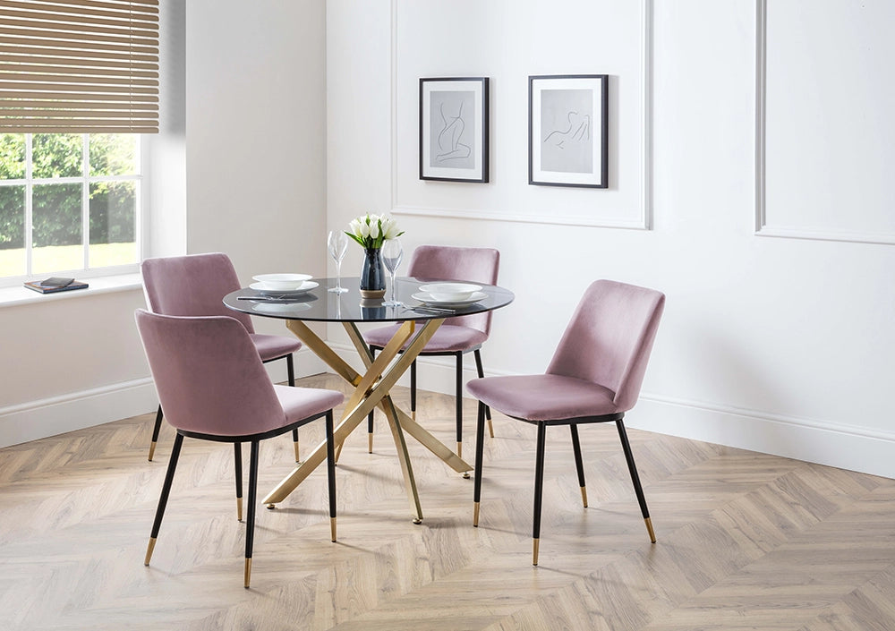 Luna Dining Chair in Dusky Pink Finish with Round Glass Top Table and Wall Frame in Breakout Setting