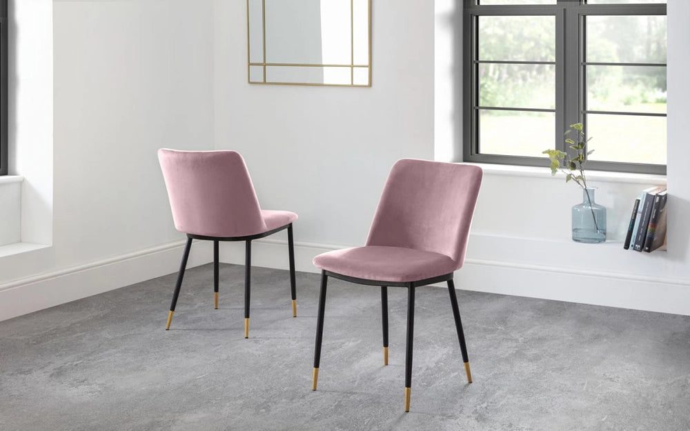 Luna Dining Chair in Dusky Pink Finish with Transparent Vase and Books in Breakout Setting