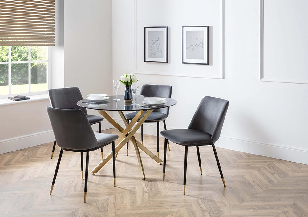 Luna Dining Chair in Grey Finish with Round Glass Top Table and Wall Frame in Breakout Setting