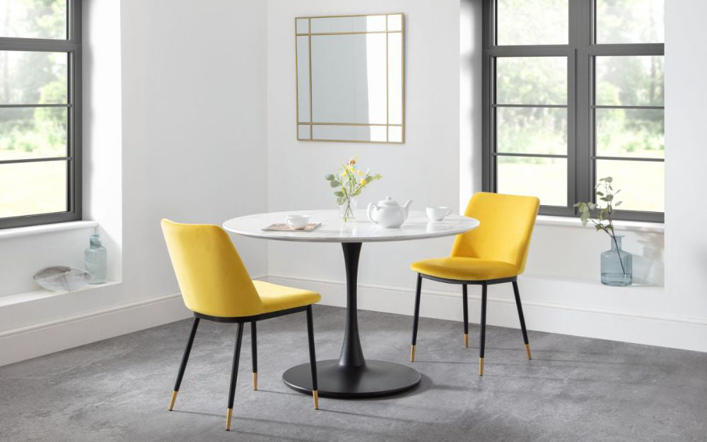 Luna Dining Chair in Blue Finish with Round Glass Top Table and Wall Frame in Breakout Setting
