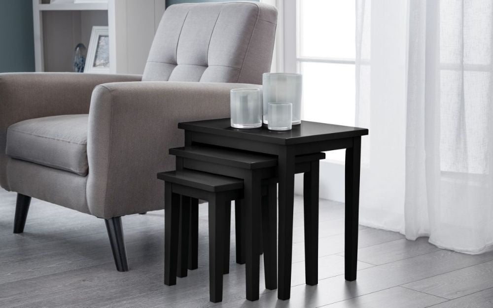 Lyon Nest Of Tables Black with Scented Candles and Armchair in Living Room Setting