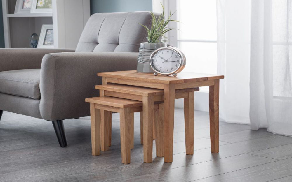 Lyon Nest Of Tables Light Oak with Alarm Clock and Armchair in Living Room Setting