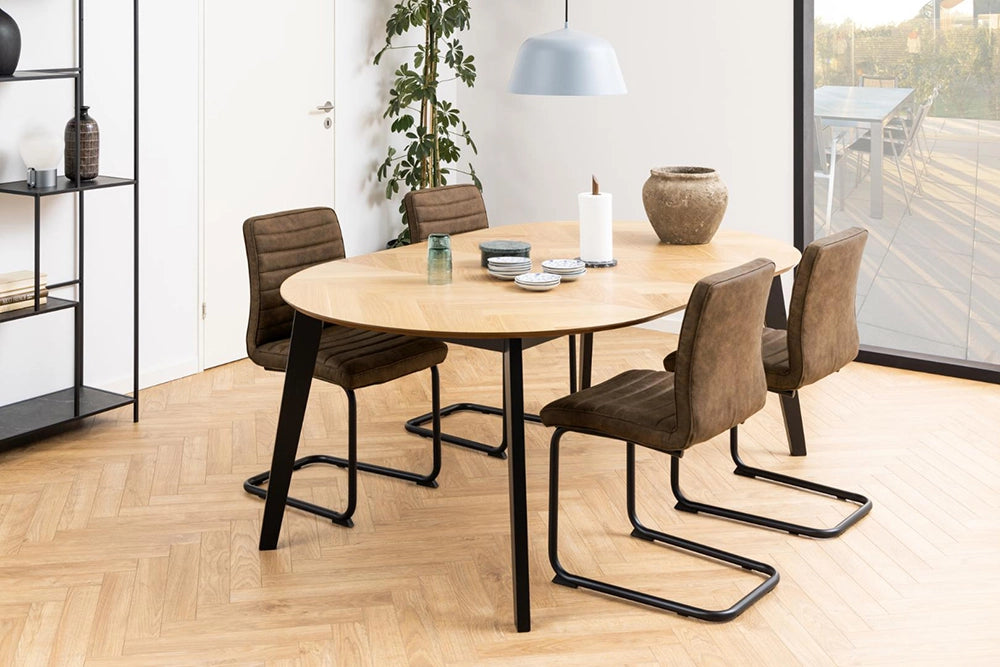 Mahon Extending Dining Table in Matte Oak Finish with Chair and Indoor Plant in Dining Room Setting