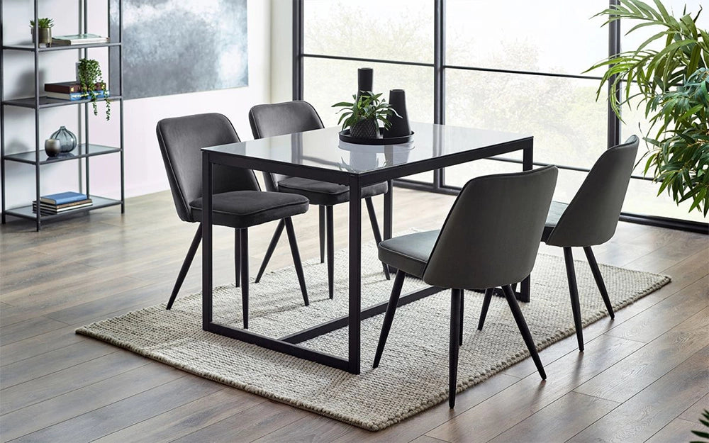 Manhattan Dining Table Smoked Glass with Grey Chair and Indoor Plant in Dining Setting