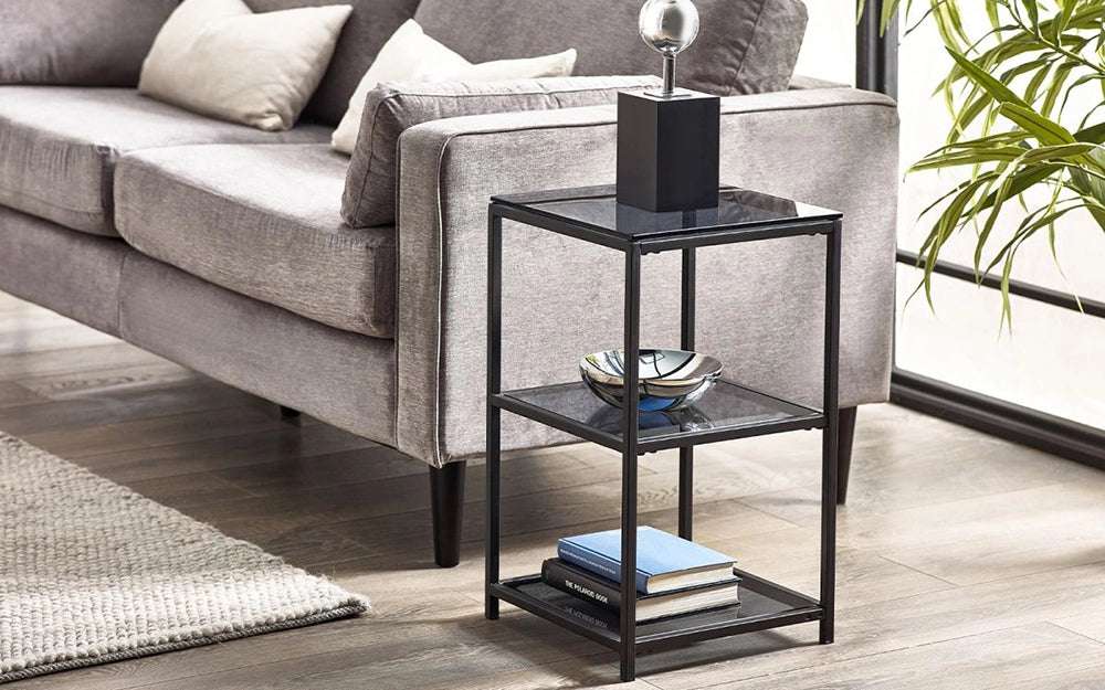 Manhattan Tall Narrow Side Table Smoked Glass with Grey Sofa and Books in Living Room Setting