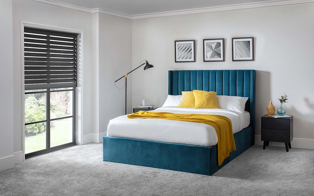 Mario Scalloped Headboard Storage Bed in Teal Finish with Wall Frames and Black Standing Lamp in Bedroom Setting
