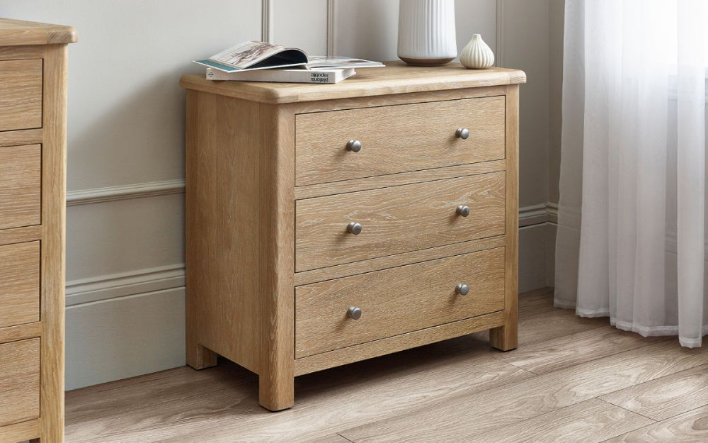 Marissa 3 Drawer Chest in Limed Oak Finish with Magazine in Bedroom Setting