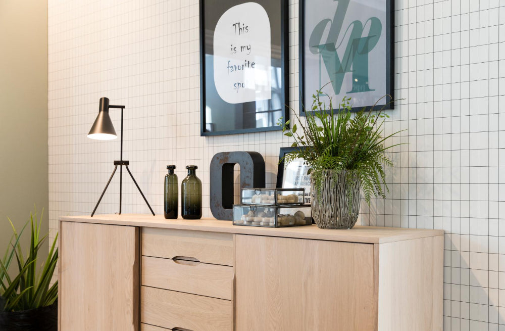 Milo White Pigment Sideboard with Indoor Plant and Table Lamp in Dining Setting