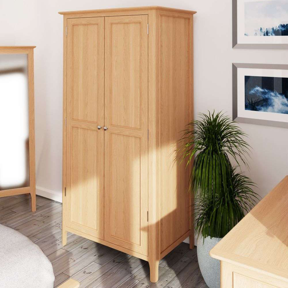 Ned Full Hanging Wardrobe in Natural Oak Finish with Indoor Plant and Freestanding Mirror in Bedroom Setting