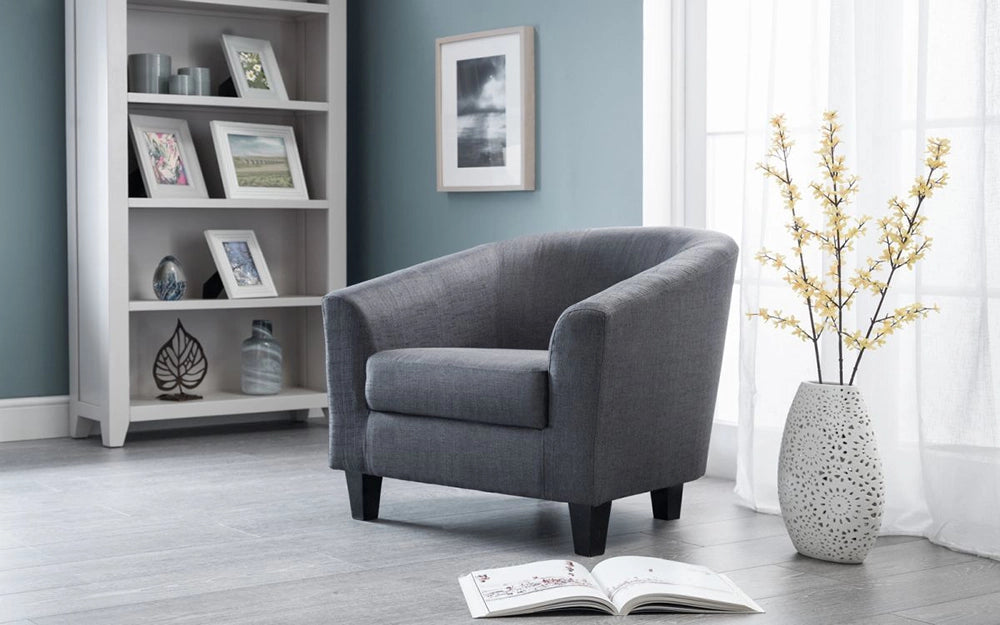 Nikki Fabric Tub Chair Slate in Grey Finish with Indoor Plant and White Picture Frame in Living Room Setting