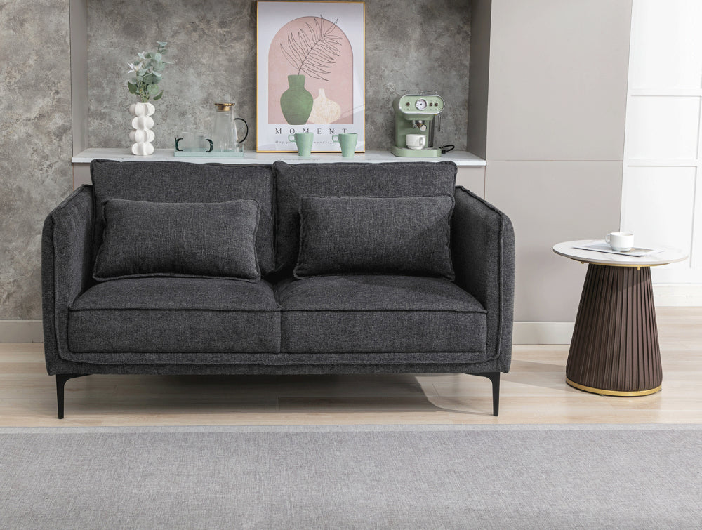 Norris 2 Seater Sofa in Dark Grey Finish with Side Table and Floor Rug in Living Room Setting 2