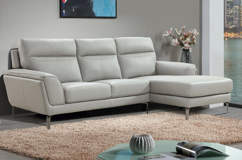 Oliver Corner Group Sofa RHF in Light Grey Finish with Vase and Floor Rug in Living Room Setting