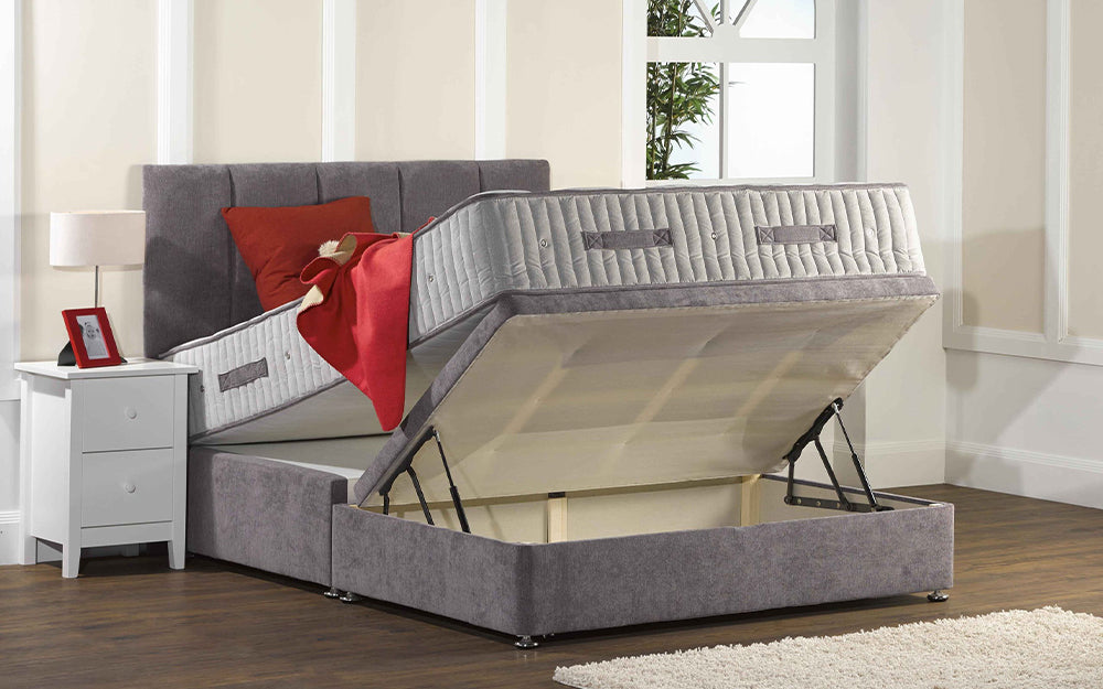 Ottoman Bed Open View in Grey Finish with Red Blanket and Pillow in Bedroom Settings