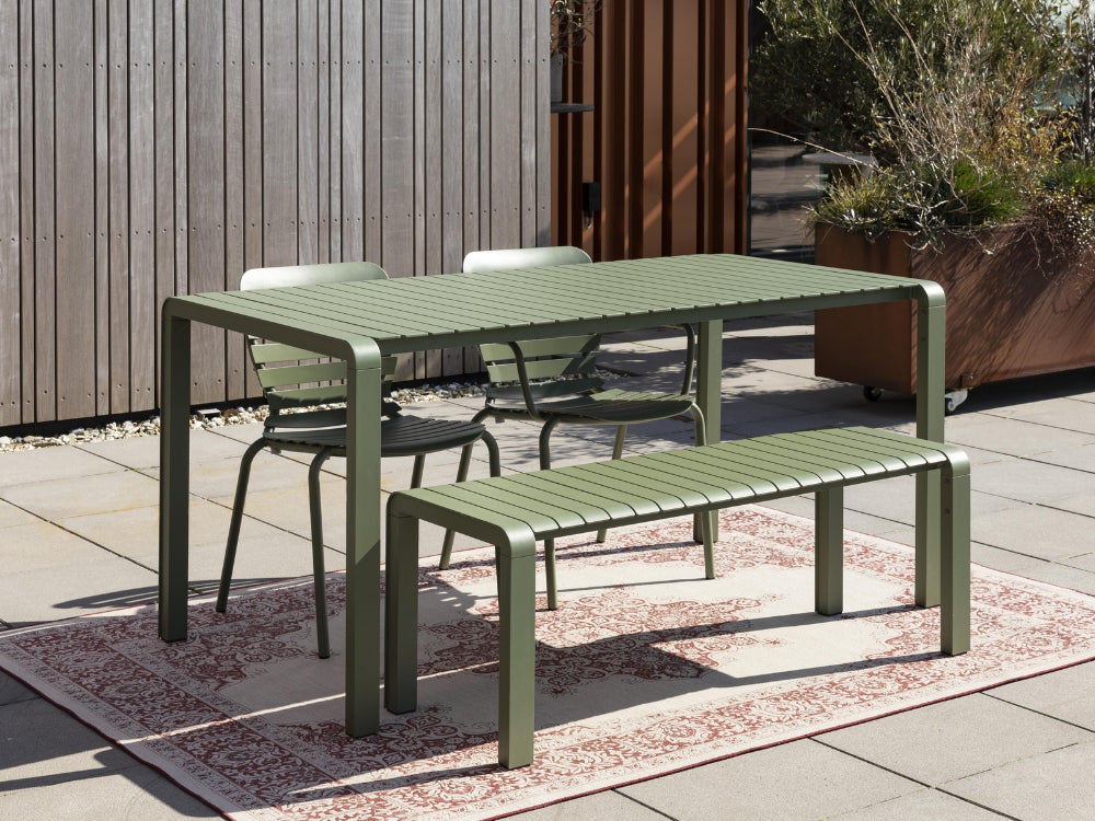 Portia Outdoor Bench 1295x450 Green with Table and Chair in Outdoor Setting