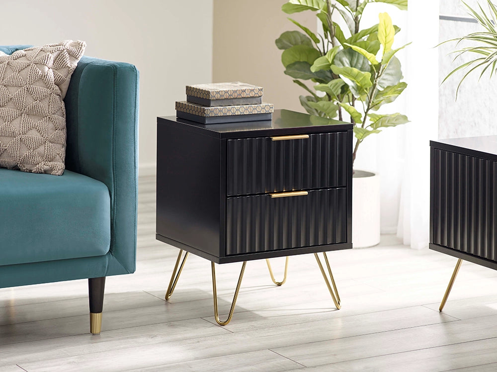 Range Lamp Table in Matte Black Finish with Indoor Plant and Upholstered Sofa in Living Room Setting