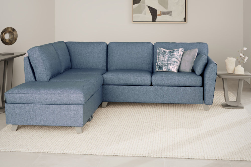 Remy Corner Sofa Blue with Side Table and Carpet in Living Room Setting