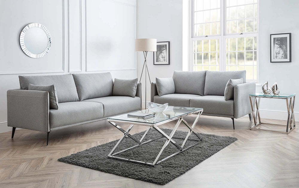 Ritz Glass Top Coffee Table with White Table Lamp and Wall Frame in Living Room Setting