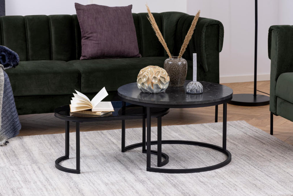 Riva Oval Round Coffee Table Smoked Glass Black Marble with Sofa and andPillowcase in Living Room Setting
