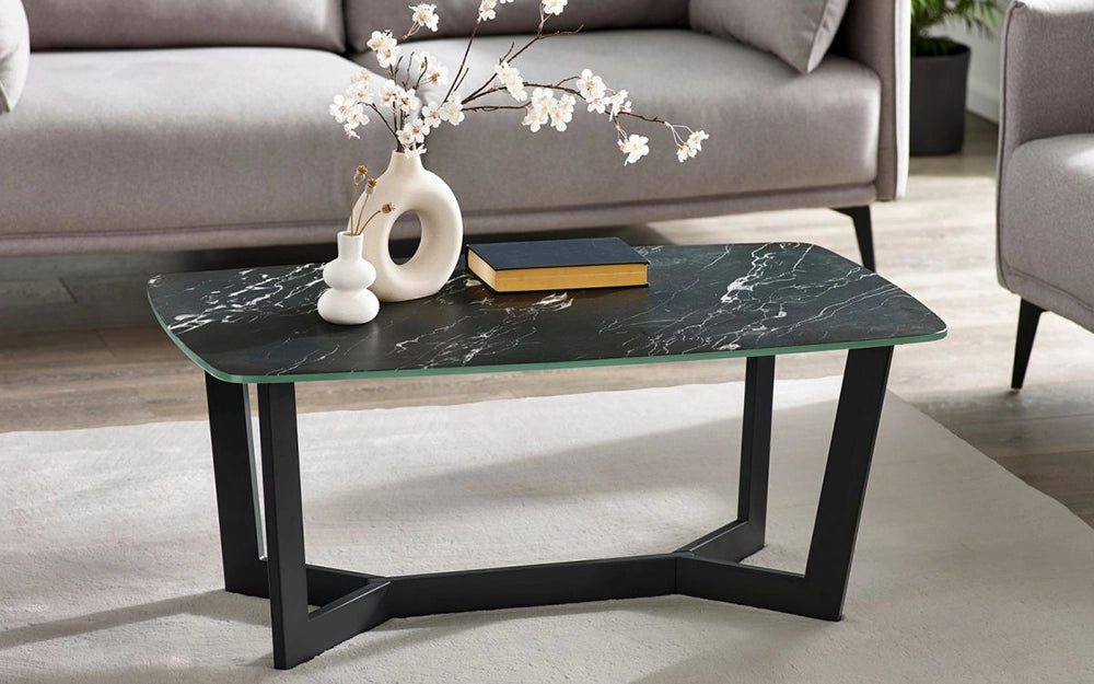 Roma Coffee Table in Black Marble Finish with Grey Sofa and Flower Vase in Living Room Setting