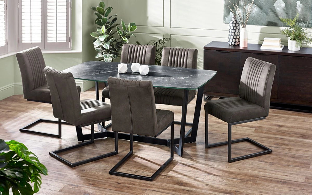 Roma Dining Table in Black Marble Finish with Brown Chair and Indoor Plant in Dining Setting