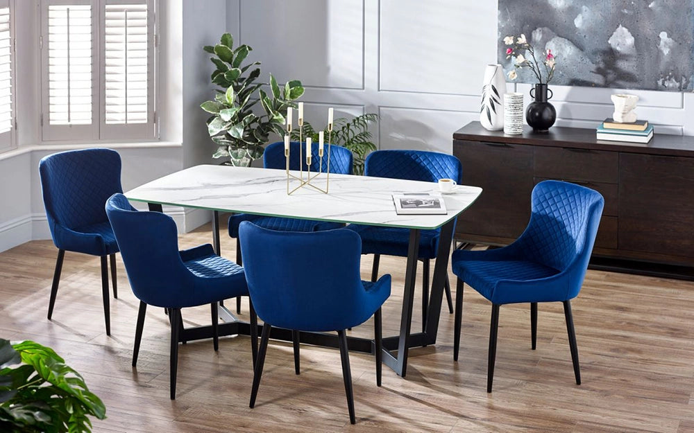 Roma Dining Table in White Marble Finish with Fabric Blue Chair and Indoor Plant in Dining Setting