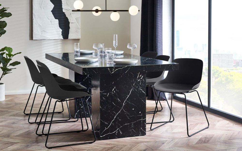 Ryker Marble Dining Table in Black Finish with Chair and Indoor Plant in Dining Setting