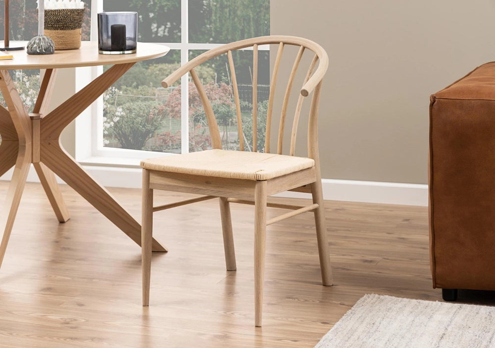 Sam Dining Chair Off White White with Round Wooden Table and Small Wicker Basket in Living Room Setting