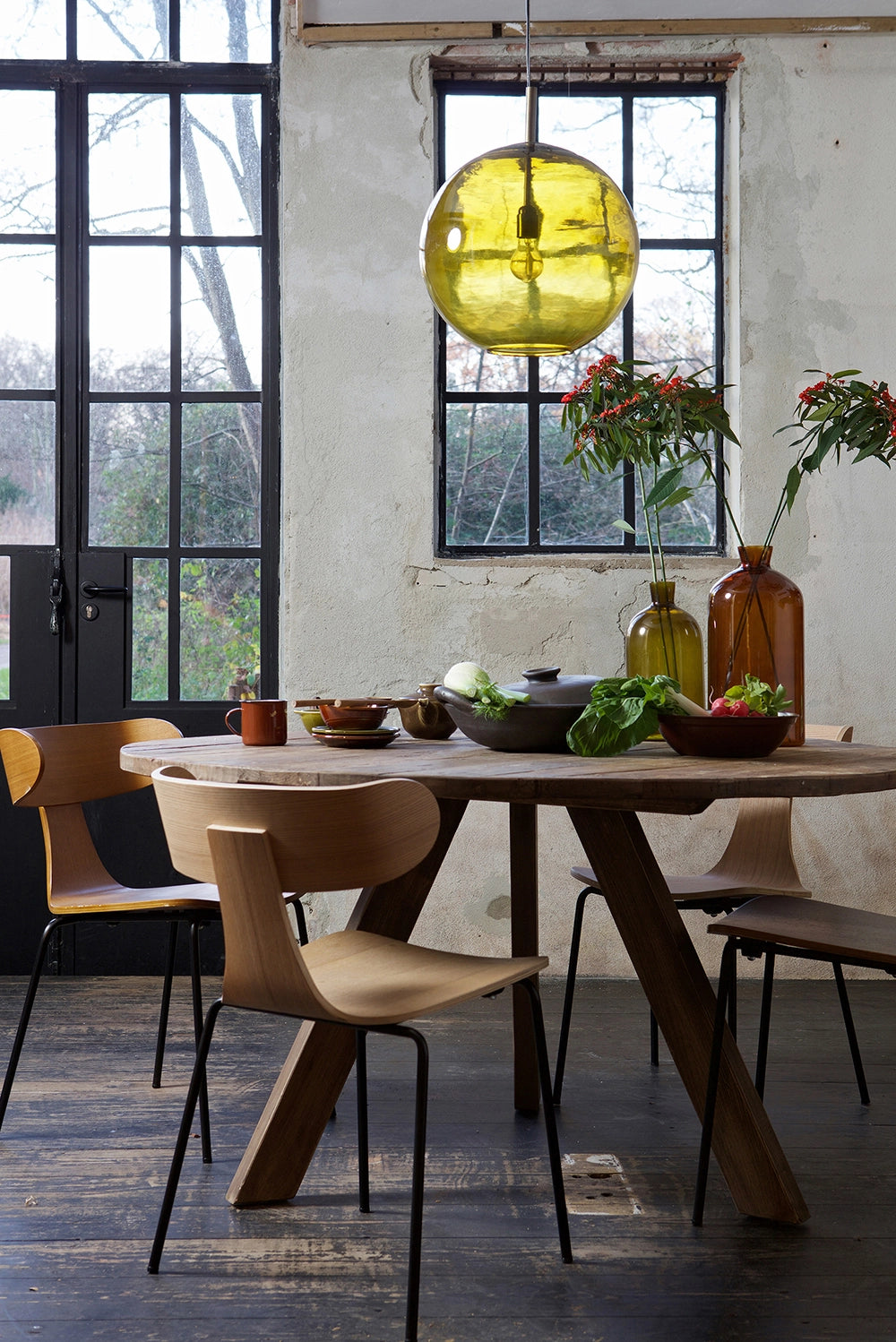 Sculpt Dining Chair Natural with Round Dining Table and Hanging Lighting in Kitchen Setting