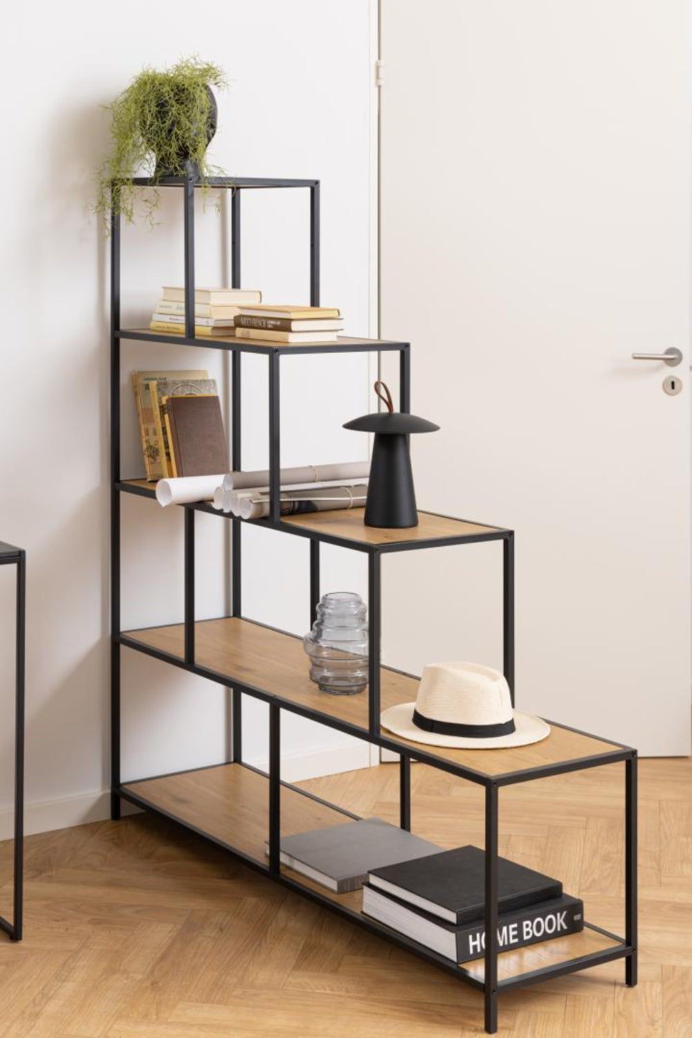 Sierra Bookcase Stepped with Books and Indoor Plant in Breakout Detail