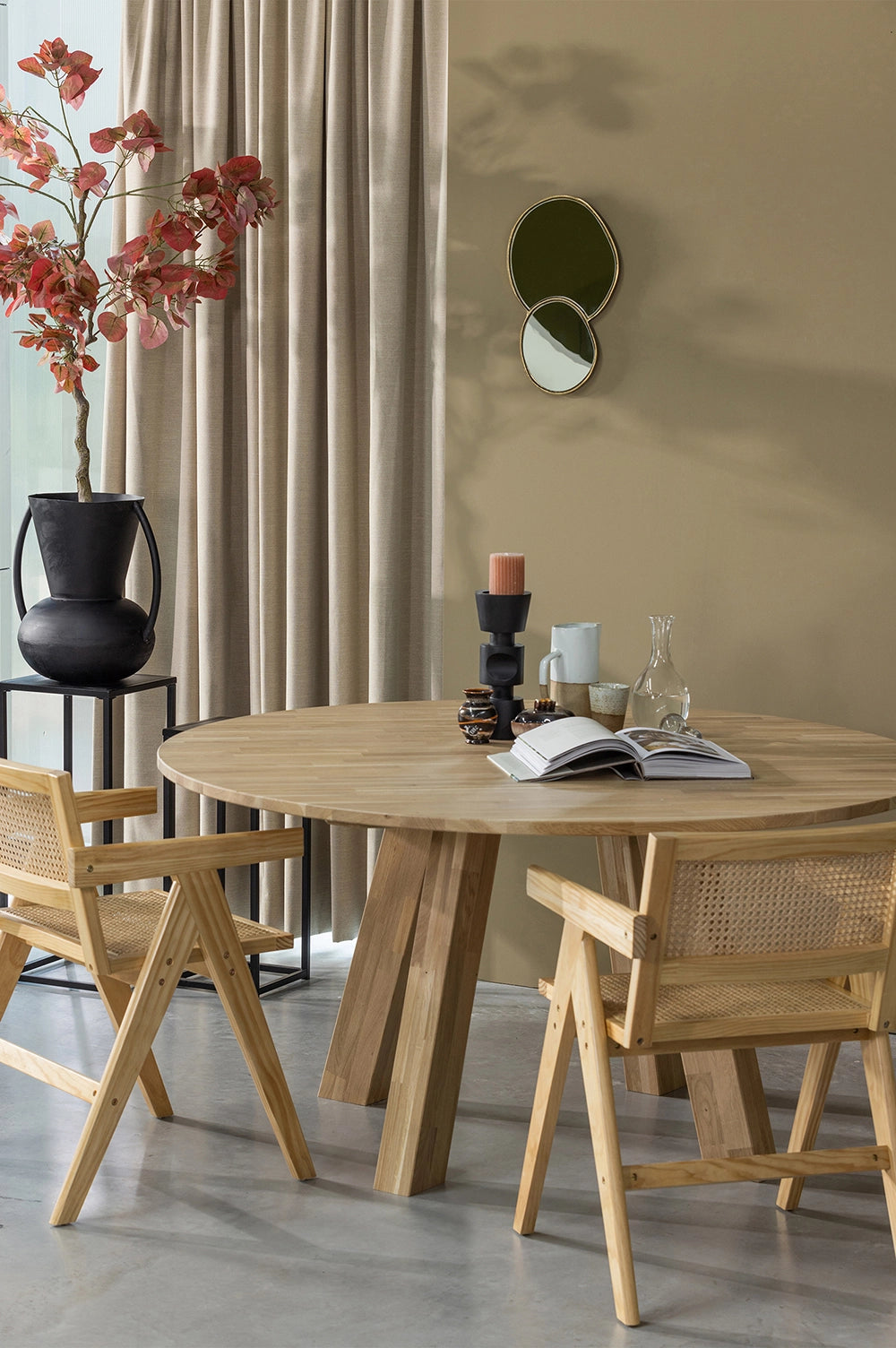 Sierra Dining Chair Natural with Round Wooden Table and Black Side Table in Dining Room Setting