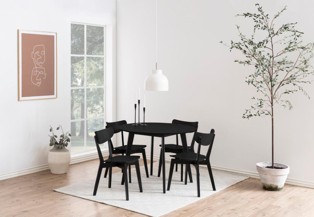 Sierra Round Dining Table Black with Indoor Plant and Chair in Bedroom Setting