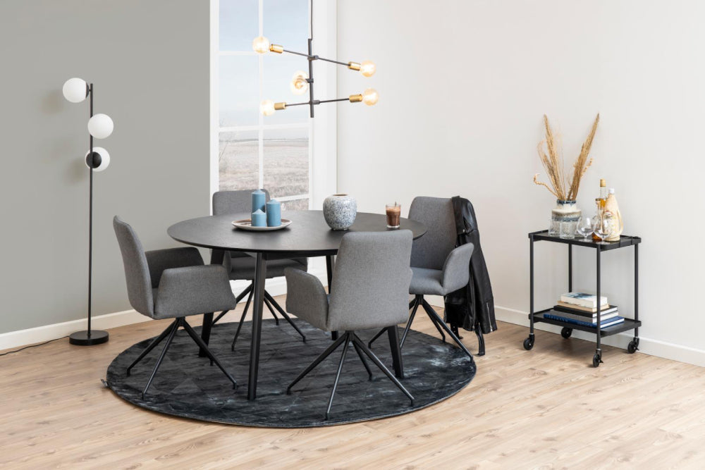 Sierra Round Dining Table in Black Finish with Upholstered Chair and Books in Breakout Setting