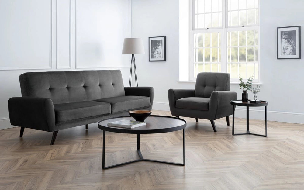 Skylar Coffee Table in Walnut Finish with Upholstered Grey Armchair and Standing Lamp in Living Room Setting