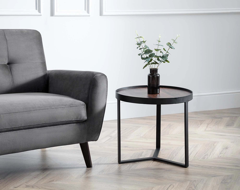 Skylar Lamp Table in Walnut Finish with Black Flower Vase and Upholstered Grey Sofa in Living Room Setting