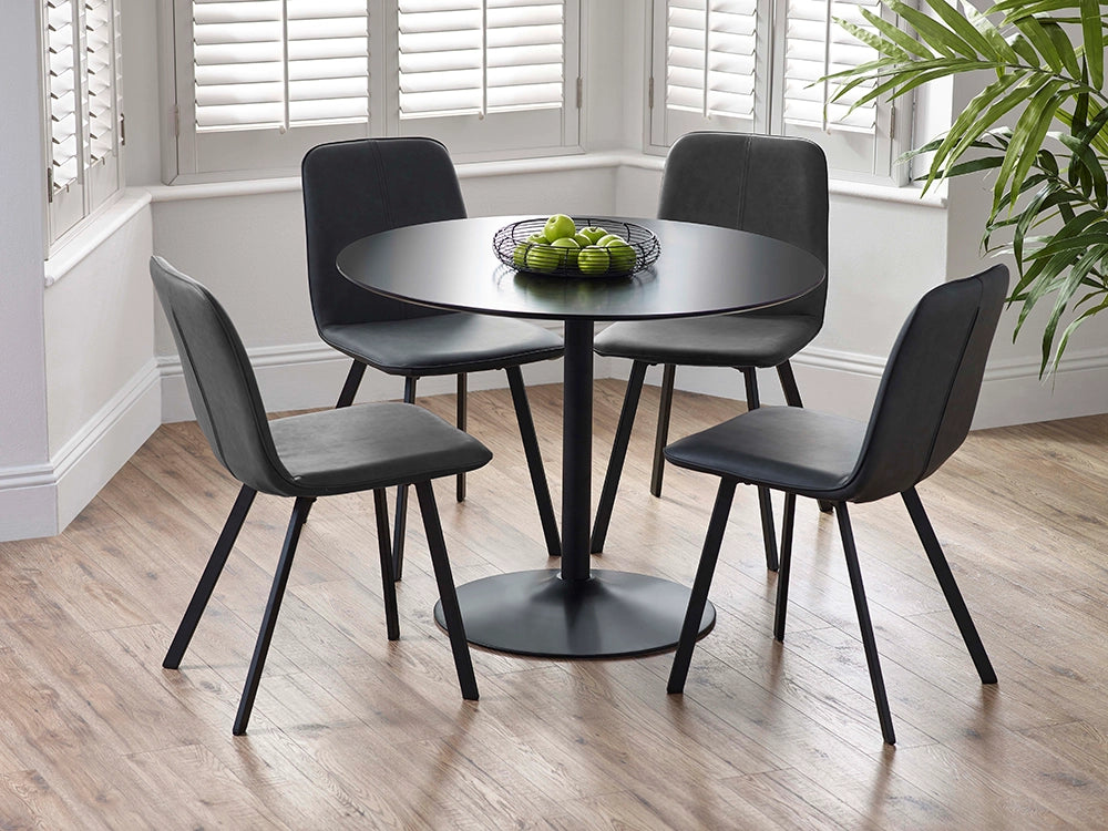 Sonya Dining Chair in Black Finish with Round Table and Indoor Plant in Breakout Setting
