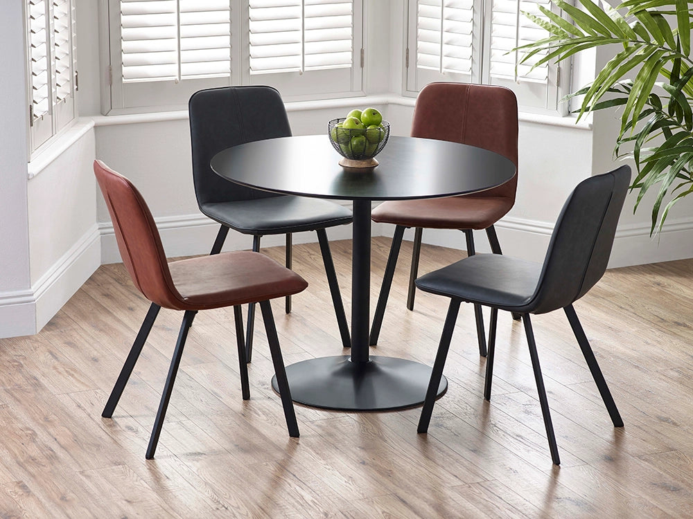Sonya Dining Chair in Black and Brown Finish with Indoor Plant and Round Table in Breakout Setting