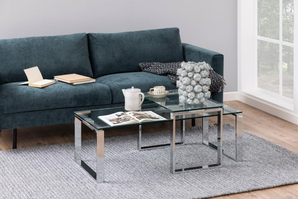 Trina Coffee Table Clear Glass and Chrome with Sofa in Living Room Setting